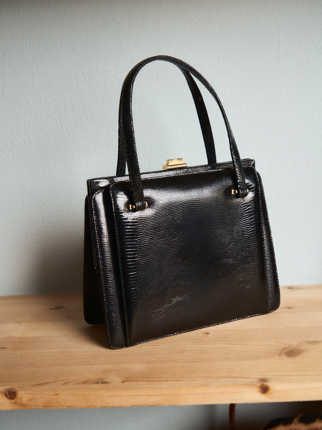 Borsa anni 60 in lucertola lucida nera