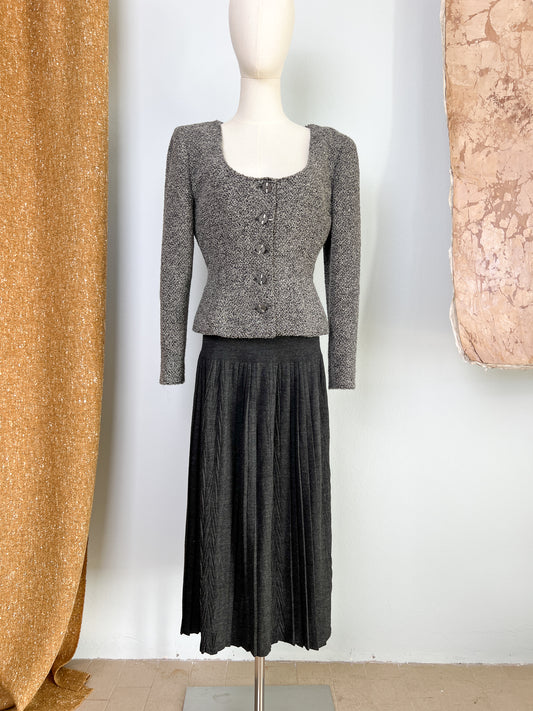 Gonna in jersey grigia con baschina e plissettatura asimmetrica