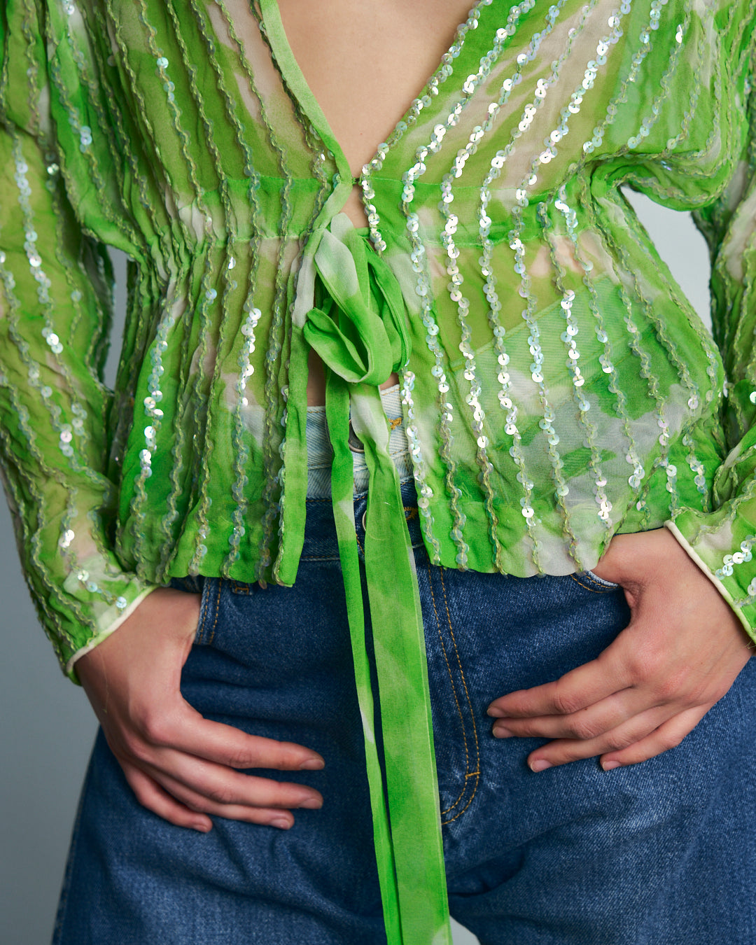Blusa in crepe trasparente con paillettes e coulisse
