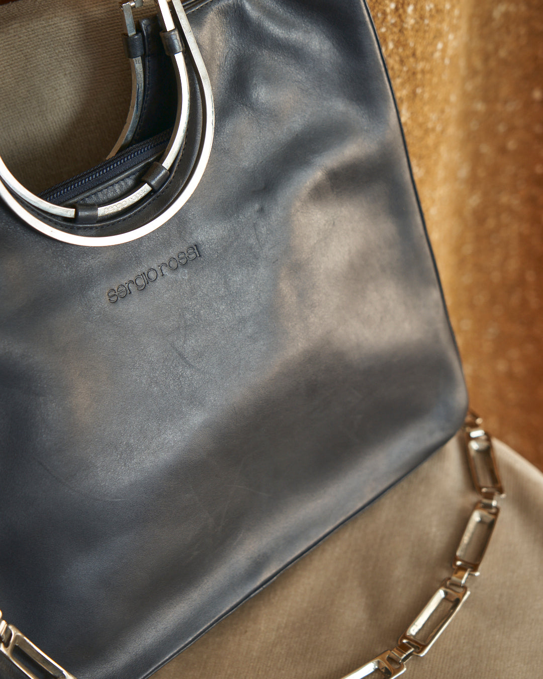 Borsa Sergio Rossi in pelle con catena e trims galvanica argento