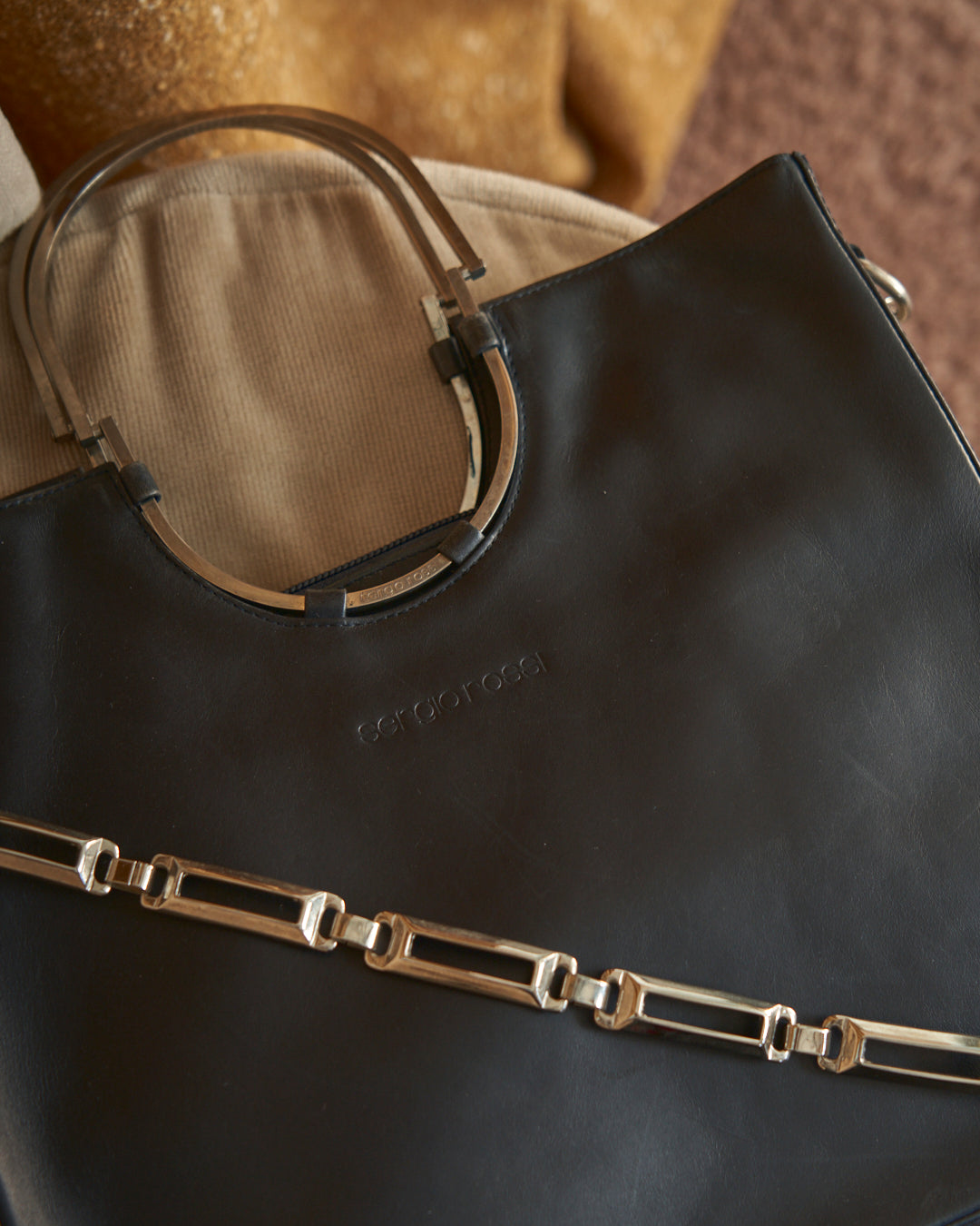 Borsa Sergio Rossi in pelle con catena e trims galvanica argento