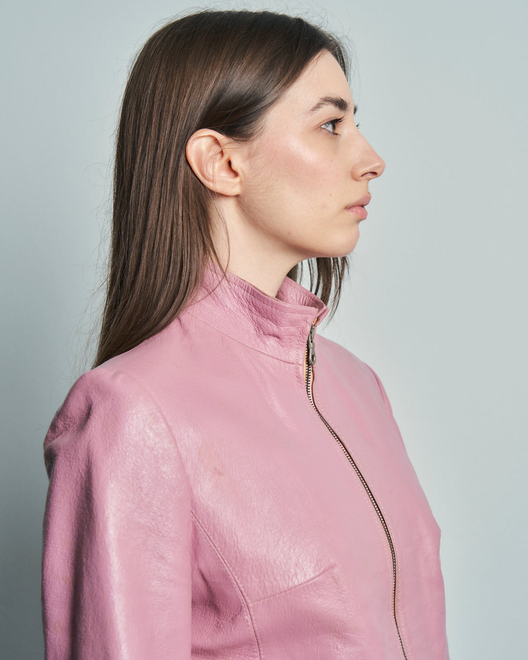 Giacca anni 90 in pelle rosa taglio accostato colletto alto e spacco davanti