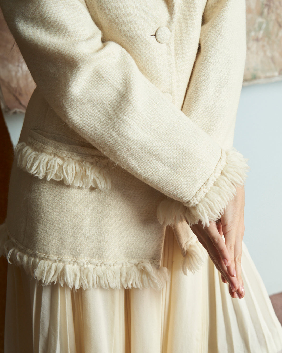 Giacca monopetto in lana e alpaca panna con frange