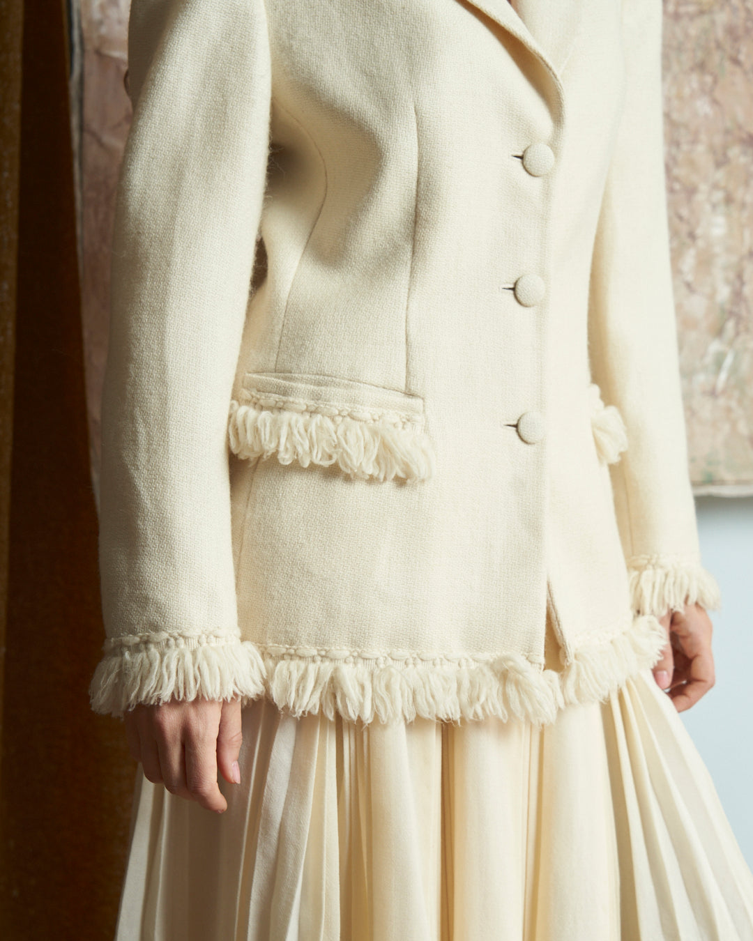 Giacca monopetto in lana e alpaca panna con frange