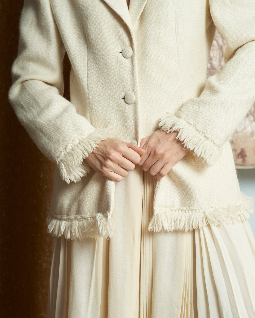 Giacca monopetto in lana e alpaca panna con frange