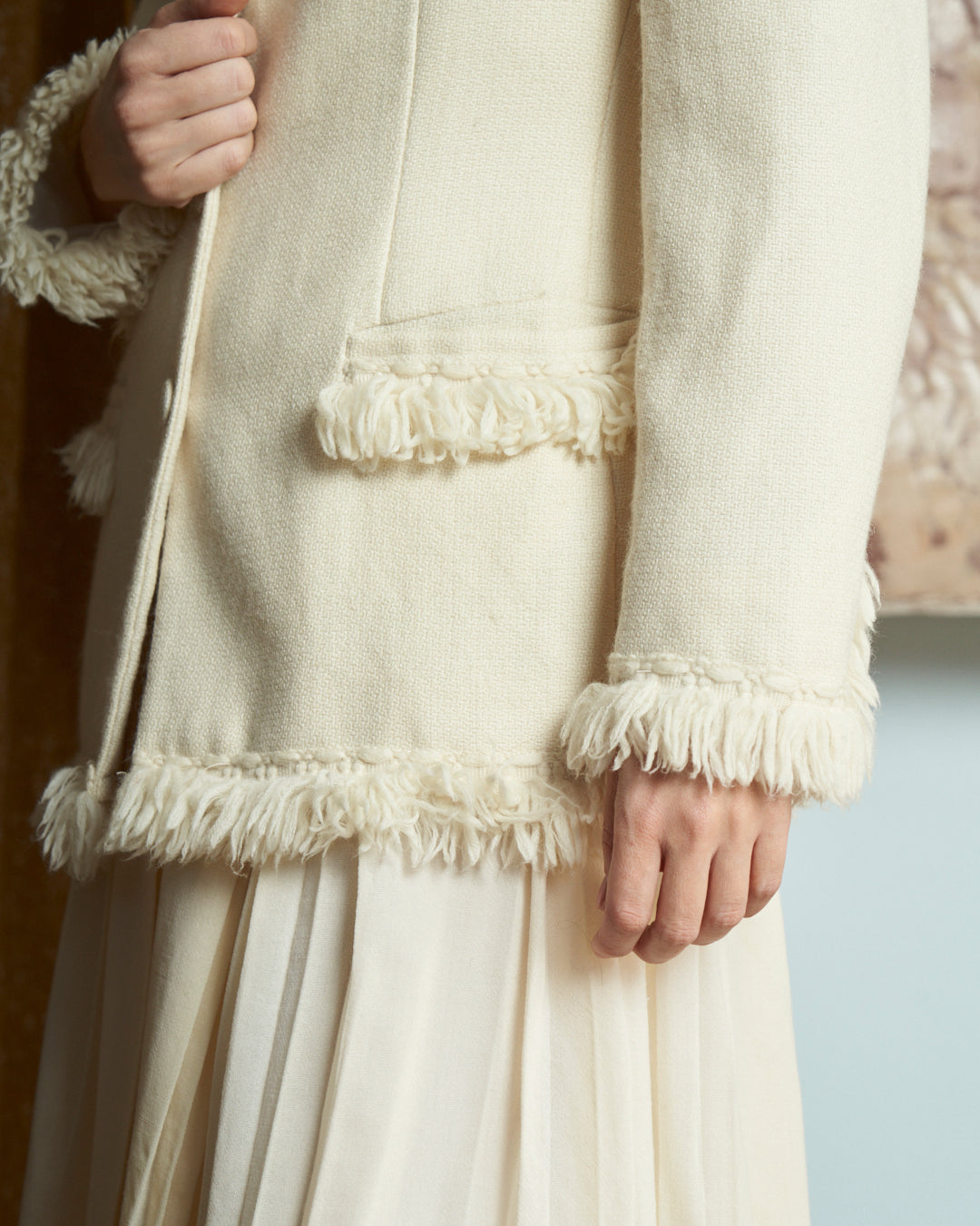 Giacca monopetto in lana e alpaca panna con frange