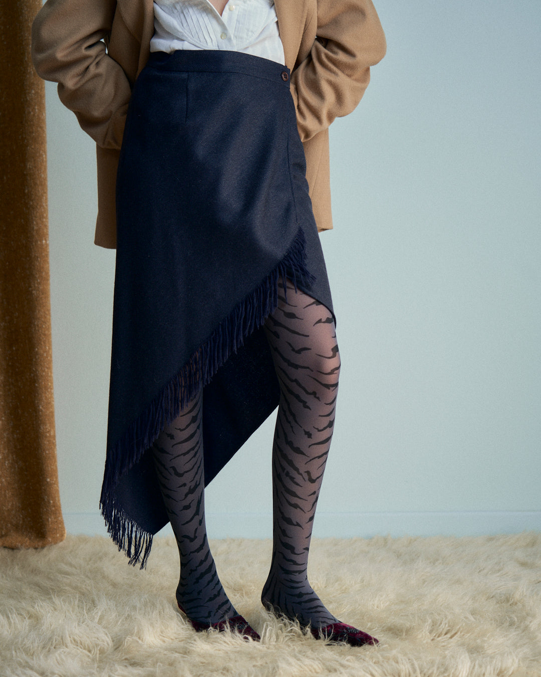 Gonna Erreuno in lana spinata con frange asimmetrica