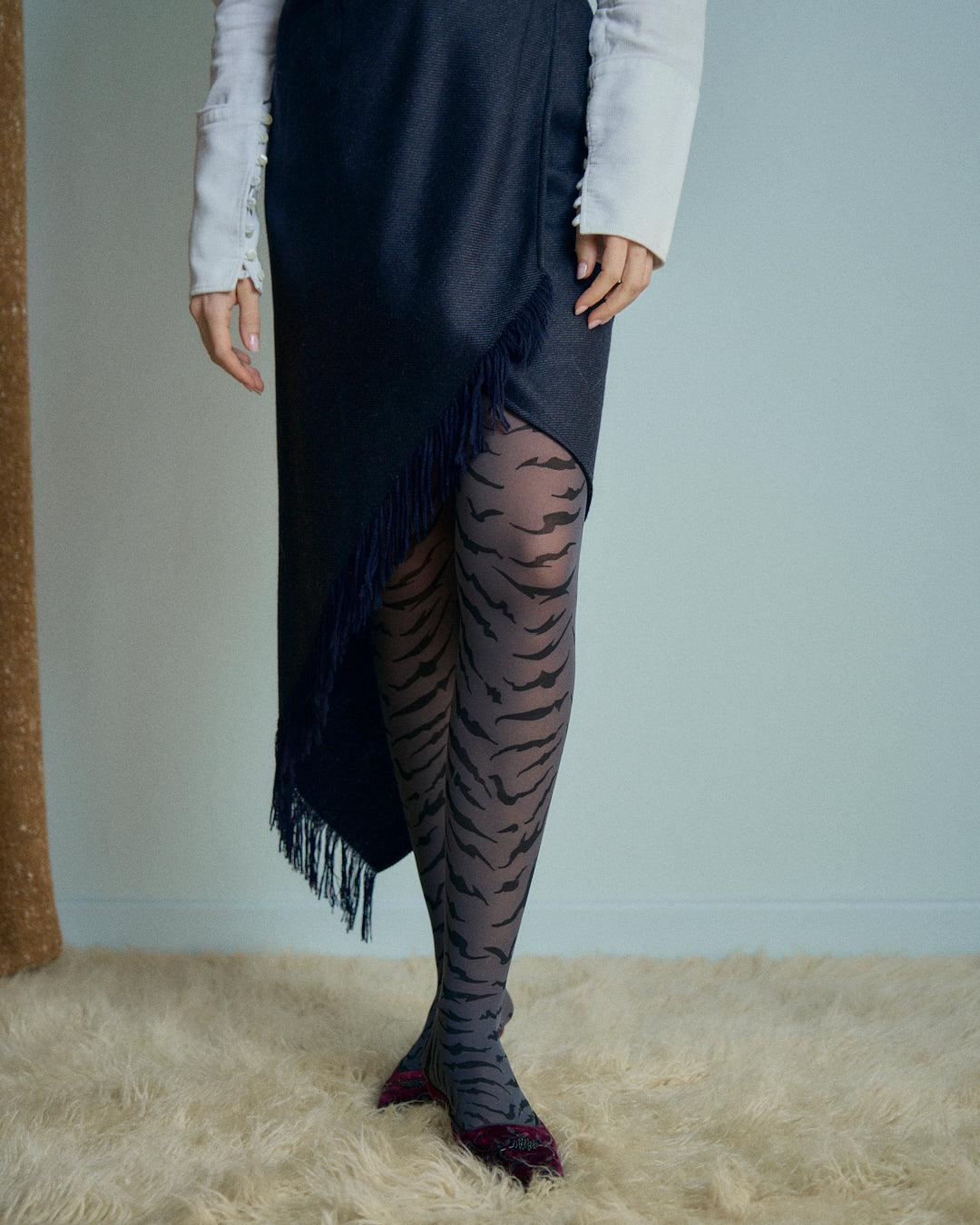 Gonna Erreuno in lana spinata con frange asimmetrica