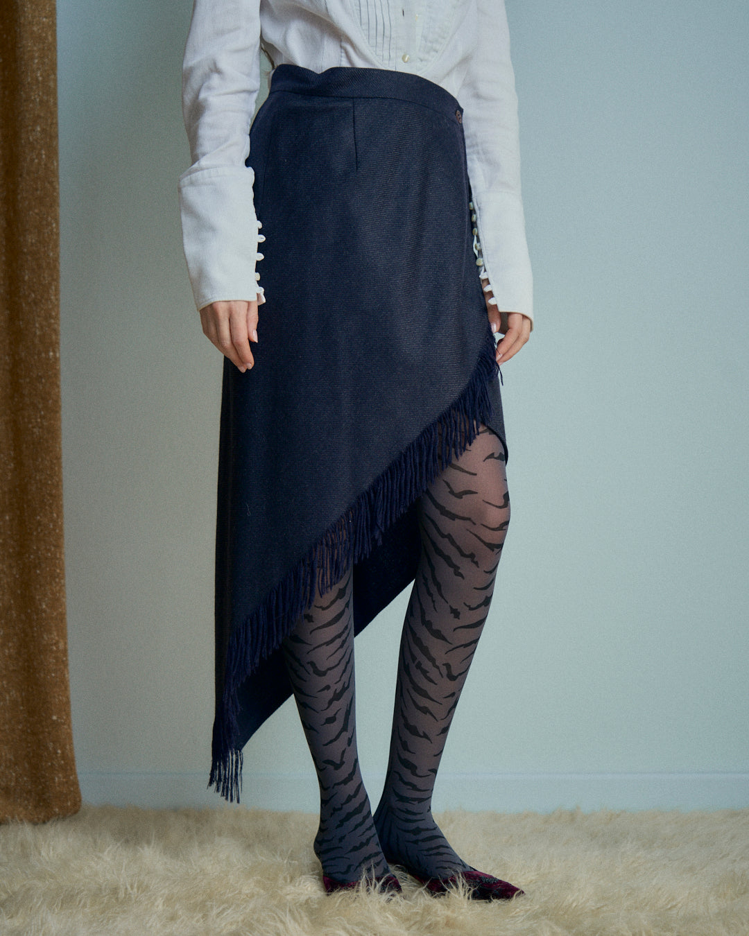 Gonna Erreuno in lana spinata con frange asimmetrica