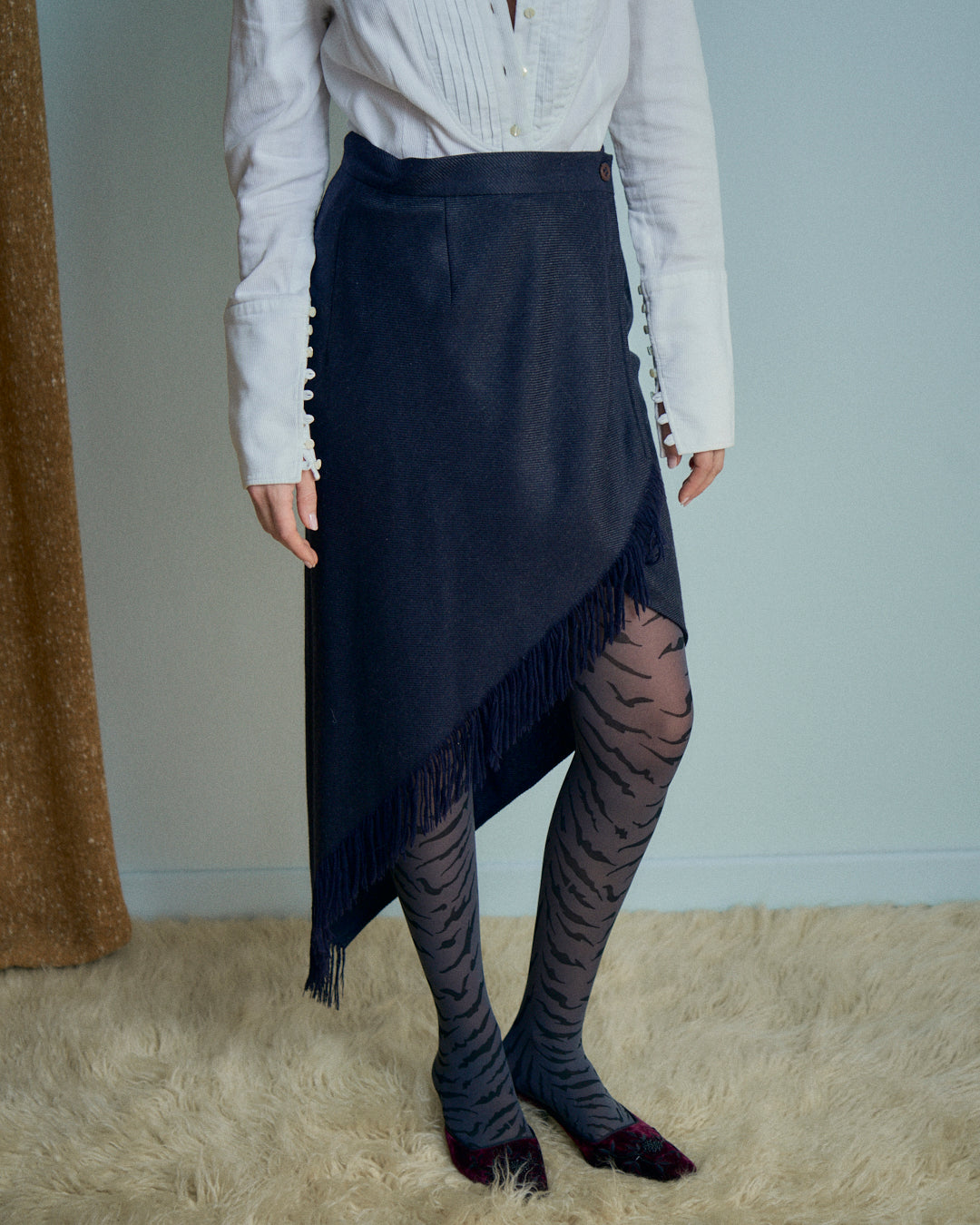 Gonna Erreuno in lana spinata con frange asimmetrica