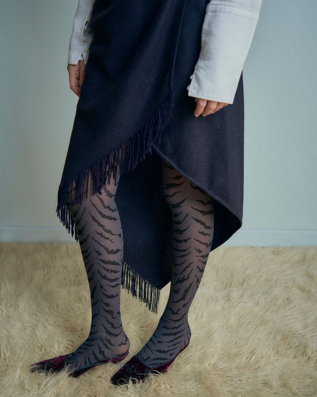 Gonna Erreuno in lana spinata con frange asimmetrica