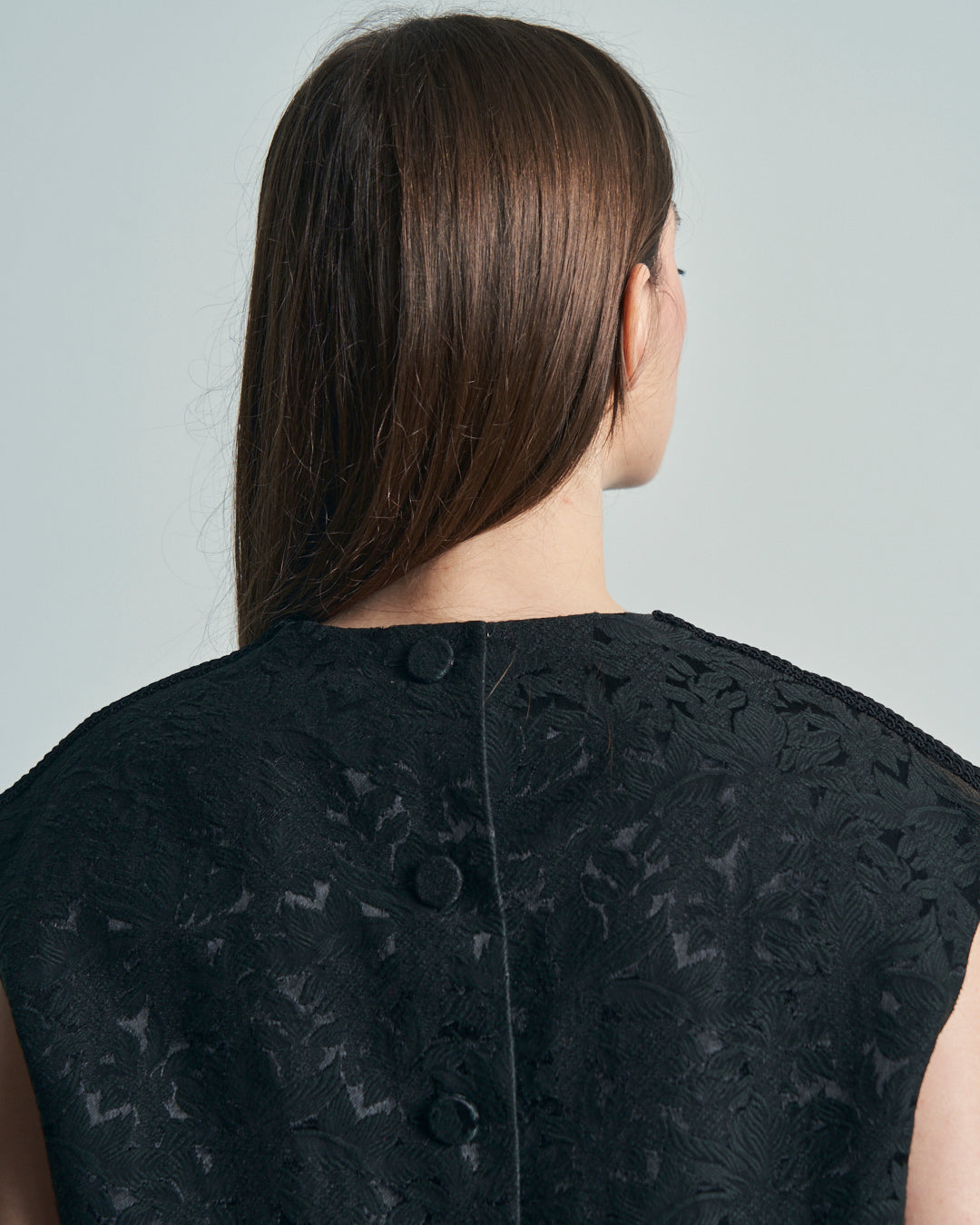 Top anni 60 in tessuto jacquard nero con fiocchi e bottoni ricoperti